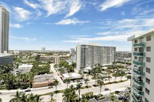 a view of a city with palm trees and buildings at THE TIDES 1bedroom apt 15th floor WE ARE ON THE BEACH! in Hollywood +26 photos