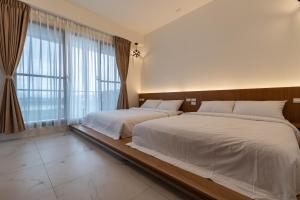 Postel nebo postele na pokoji v ubytování FUN Style Homestay