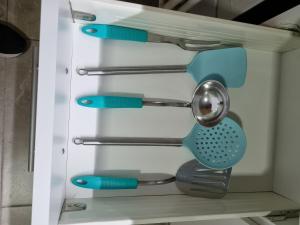 a drawer filled with utensils in a kitchen at Departamento Vera Mujica 3 cochera propia incluida in Rosario