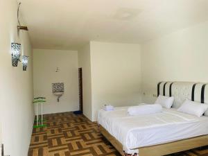 Vandu's View Guest house & Restaurant客房内的一张或多张床位