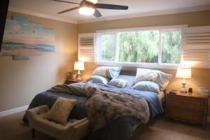a bedroom with a bed and a window at Casa Esperanza. Peaceful Get Away W/Hot tub. in Salinas