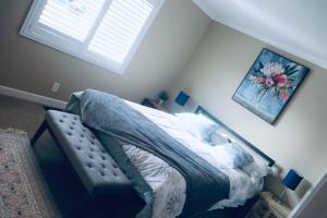 a bedroom with a bed and a window at Casa Esperanza. Peaceful Get Away W/Hot tub. in Salinas
