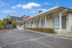 a parking lot in front of a building at Mibnb Geelong CBD Spacious Studio Apartments in Geelong