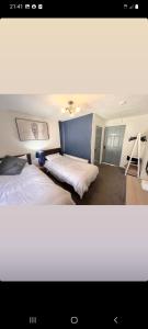 a bedroom with two beds in a room at Ardhill House B&B The Diamond, in the Heart of Ardara Town , F94 C7X9 in Ardara