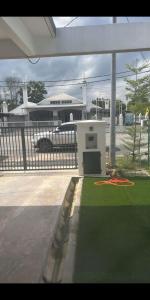 a appliance sitting on the grass in a yard at ZR D'Chili Homestay, Kemaman in Cukai
