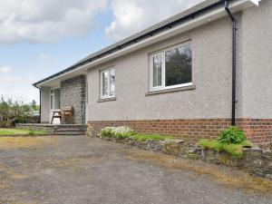 a brick house with a driveway in front of it at Greentops in Blackwood