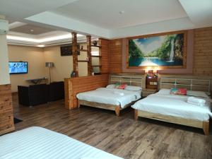 Postel nebo postele na pokoji v ubytování Hotel Balik Pulau