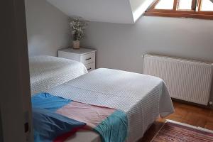 a bedroom with a bed and a dresser and a window at Escape to Bird's Nest in Buyukada in Adalar