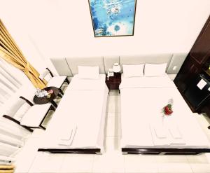 Postel nebo postele na pokoji v ubytování Dương Đông Hotel