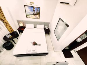 Postel nebo postele na pokoji v ubytování Dương Đông Hotel