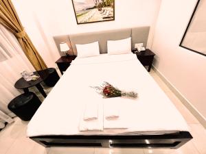 Postel nebo postele na pokoji v ubytování Dương Đông Hotel