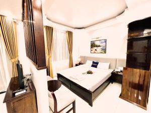 Postel nebo postele na pokoji v ubytování Dương Đông Hotel