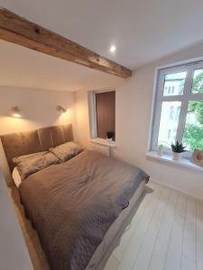Postel nebo postele na pokoji v ubytování Apartament Parkowa - Loft in Cieplice