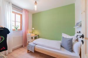 Postel nebo postele na pokoji v ubytování Roomerie