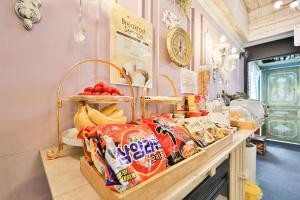 a counter with bags of chips and other snacks at Daegu February Hotel Suseong in Daegu