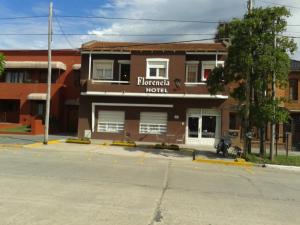 a building on the corner of a street at Hotel Florencia in Necochea