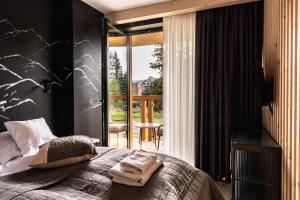 Posteľ alebo postele v izbe v ubytovaní ZAKOHOME- Apartamenty Sabały