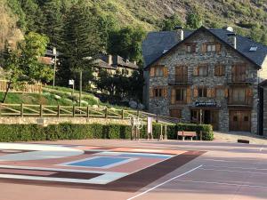 a basketball court in front of a building at Apartaments El Tarter in Erill la Vall