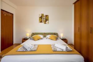 Postel nebo postele na pokoji v ubytování Villa Salvia Mare + 26 fotografií