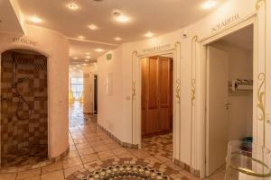 a hallway with a walk in shower in a building at Residence Diana Apartment 202 in Terento +21 photos