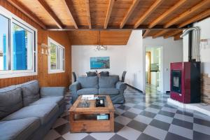 a living room with a couch and a table at Casa Bahía de Alcudia in Port d'Alcudia