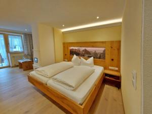 Postel nebo postele na pokoji v ubytování Hotel Bergheimat