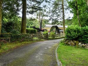 a road in a park with a playground and a slide at Lower Lodge in Bugle