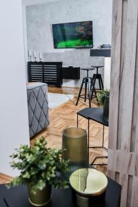 TV i/ili multimedijalni sistem u objektu Cozy Apartment Plus