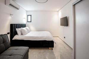 Ένα ή περισσότερα κρεβάτια σε δωμάτιο στο Coral suites Boutique +44 φωτογραφίες