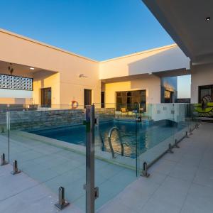 a swimming pool in the middle of a building at The Dannah in Barka