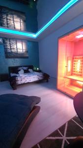 a bedroom with a bed and a large glass door at Apartman Melody in Paraćin