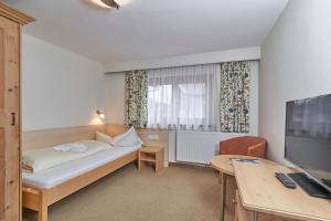 Postel nebo postele na pokoji v ubytování Pension Grünerhof