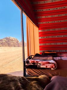 a view of the desert from the inside of a train at Wadi Rum Desert Wonders in Wadi Rum