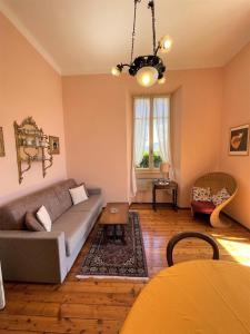 a living room with a couch and a table at San Giusto I Villen-Ferienwohnung (EG) in Menaggio
