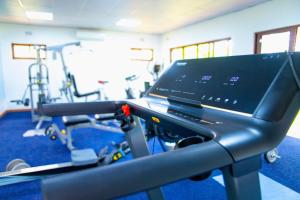 a room with a gym with a treadmill at Burley House by Ulendo in Lilongwe