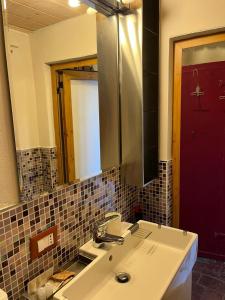 a bathroom with a sink and a mirror at La Conchiglia in Scarlino