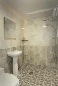 a bathroom with a sink and a toilet at Berion Reosrt in Pyeongchang