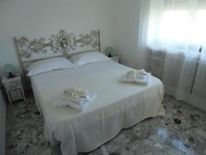 A bed or beds in a room at La Mouette di Nico