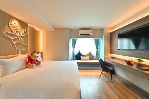 Letto o letti in una camera di Moose Hotel Nimman
