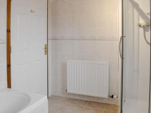 a bathroom with a shower and a sink at Bridge Street Close in Cockermouth