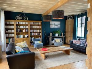 a living room with a couch and a coffee table at Gaston en Baie in Villers-sur-Authie