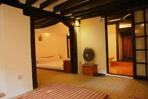 Newa Chen Historic House UNESCO客房内的一张或多张床位
