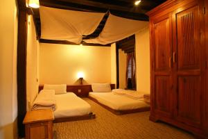 Newa Chen Historic House UNESCO客房内的一张或多张床位
