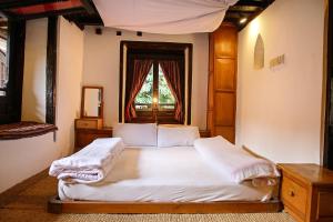 Newa Chen Historic House UNESCO客房内的一张或多张床位