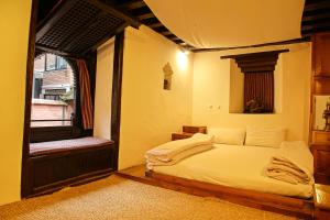 Newa Chen Historic House UNESCO客房内的一张或多张床位