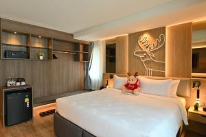 Letto o letti in una camera di Moose Hotel Nimman