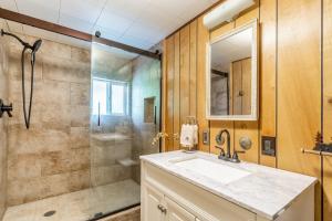 a bathroom with a sink and a shower at Fish On! in Hungry Horse +70 photos