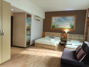 Postel nebo postele na pokoji v ubytování Hotel Balik Pulau