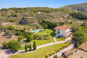 an aerial view of a house on a hill at Villa Amarandes by Villa Plus in Paradeísion