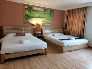 Postel nebo postele na pokoji v ubytování Hotel Balik Pulau + 37 fotografií